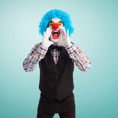 portrait of a funny clown over white